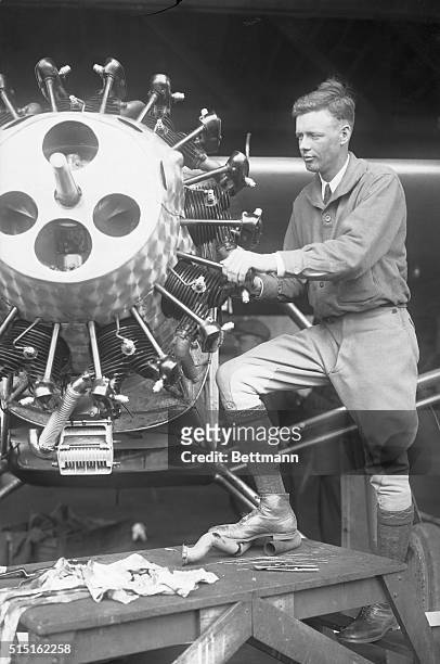 Charles Lindbergh Inspecting Airplane Motor for His Transatlantic Flight