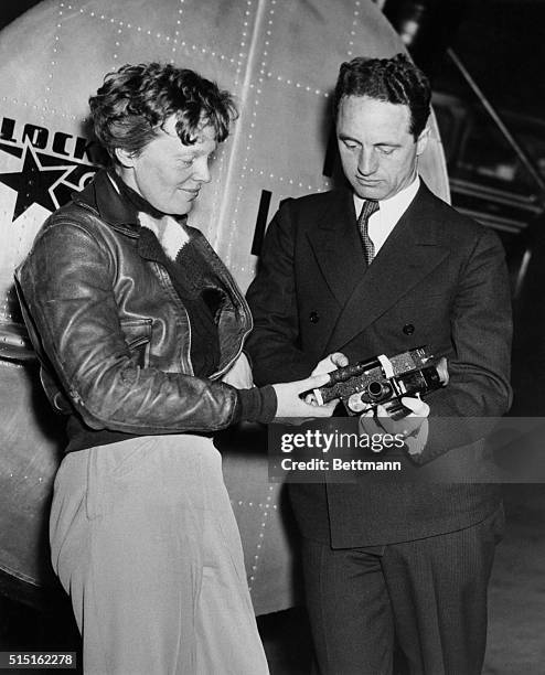 Amelia Earhart with her second navigator, Harry Manning, who along with Fred Noonan, was scheduled to participate in Earhart's round-the-world...