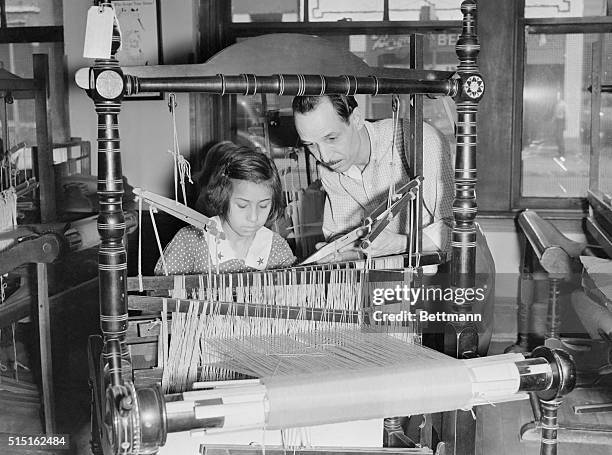 Girls working at looms at Hull house in Chicago, Ill., which was founded by Jane Addams.