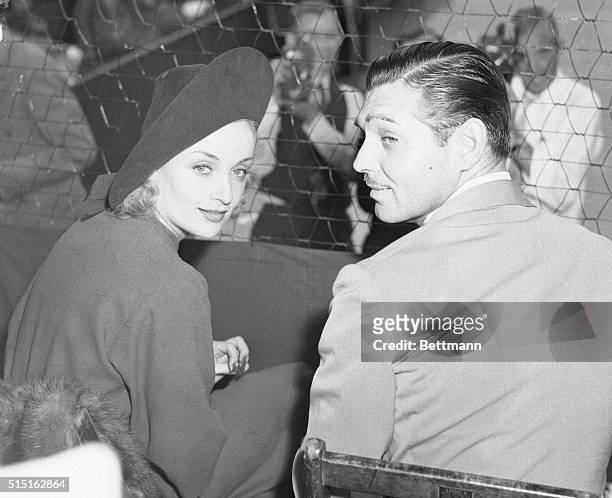 It may be romance and then again, it may not, but Clark Gable and Carole Lombard are seen together once again as they attend the matches at the Los...