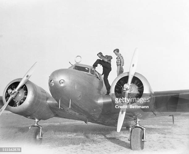 Captain Fred Noonan and pilot Amelia Earhart enter their Lockheed Electra 10E in San Juan, Puerto Rico, during Earhart's around-the-world flight...
