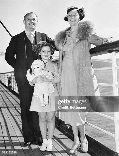 Shirley Temple and her parents, Mr. And Mrs. George Temple, are pictured aboard the liner Malolo, sailing from San Francisco, for a vacation in...