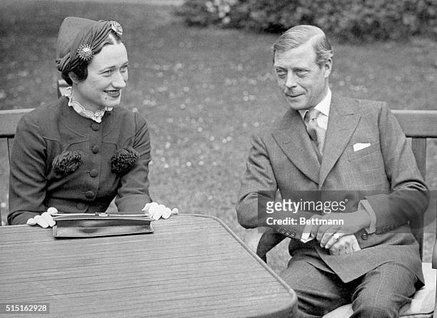 France: Edward VIII, Duke of Windsor, sits with his wife Wallis Simpson at the Chateau de Cands in France. Photo shows a close-up view of the couple.