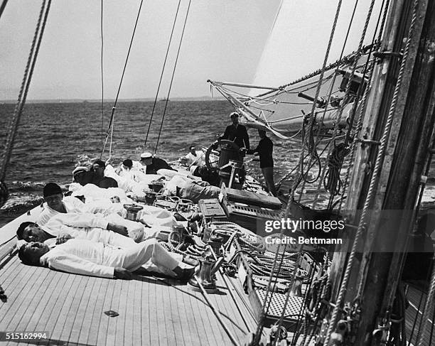 The cameraman had a difficult time remaining on even keel, in taking this picture on the deck of Harold S. Vanderbilt's cup defender, Ranger, as...