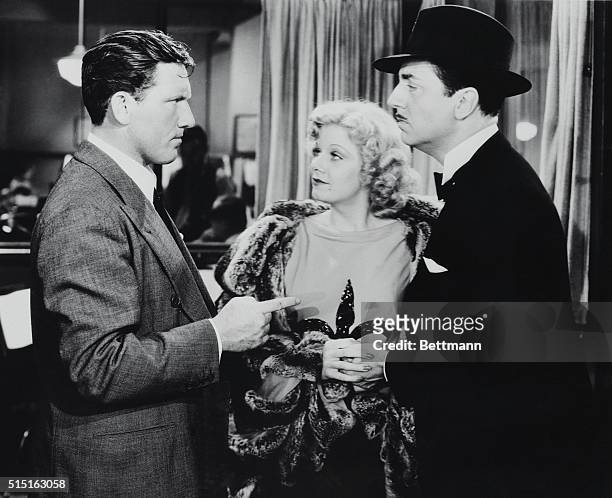 Prominent actors Spencer Tracy , Jean Harlow and William Powell in a scene from the 1936 film, Libeled Lady, directed by Jack Conway.