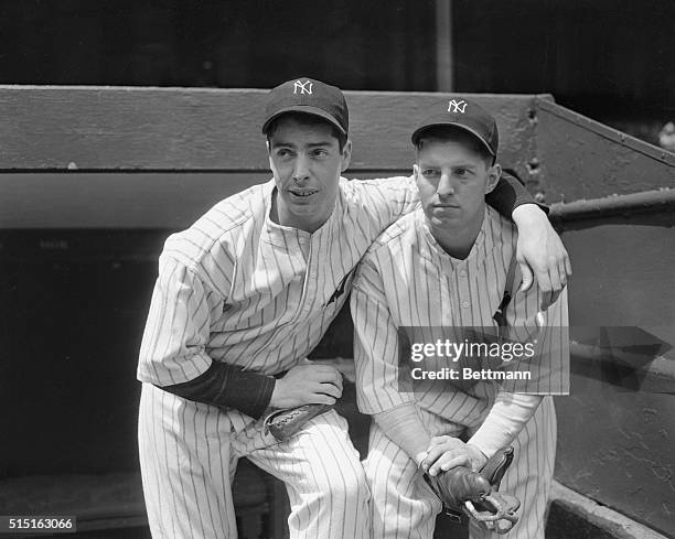 Joe DiMaggio, left, star rookie of the Yankees in 1936, poses with the 1937 recruit who is filling his shoes as the stellar attraction of 1937, Tom...