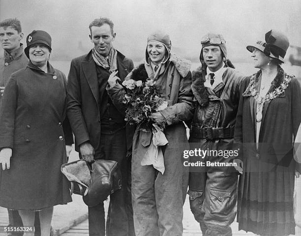 From left to right: Mrs. Frederick Guest , flight mechanic Lou Gordon, Amelia Earhart, pilot Wilmer Stultz and Mrs. Foster Welsh, the mayor of...