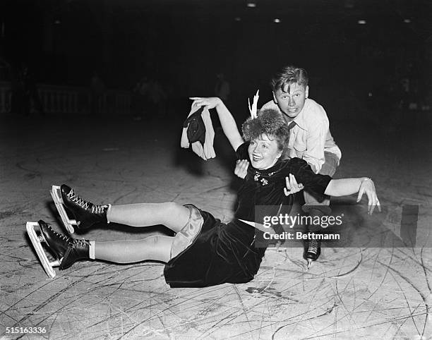 Mickey Rooney Rescues Nancy Carroll. Hollywood, Cal.: With some of Hollywood's brightest satellites on hand for the premiere, the 1939 Ice Follies...