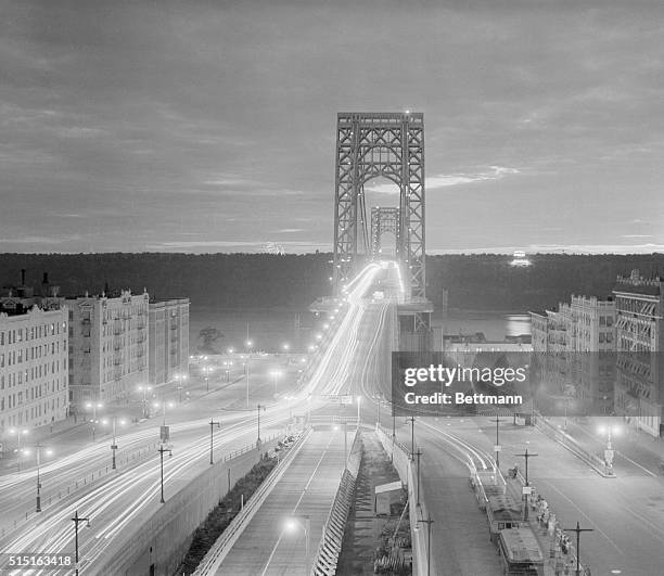The automobile headlights of road weary New Yorkers returning from their fourth of July weekends made these unending streaks of lights as thousands...