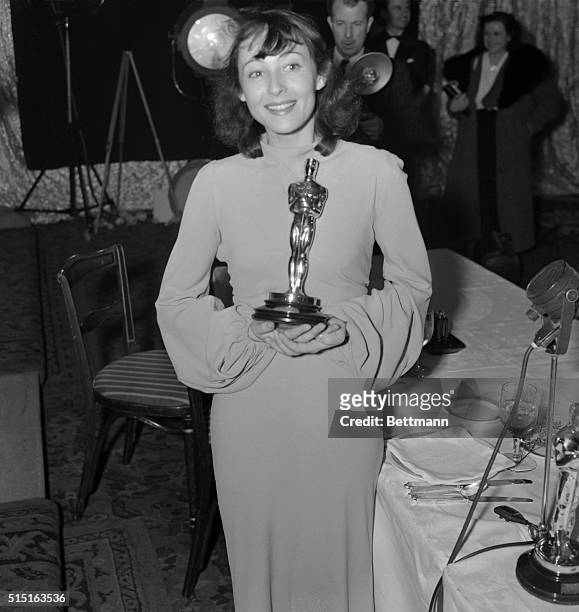 Louise Rainer, Viennese actress, pictures with her trophy, emblematic of the best performance by a film actress for 1937, after it was presented her...