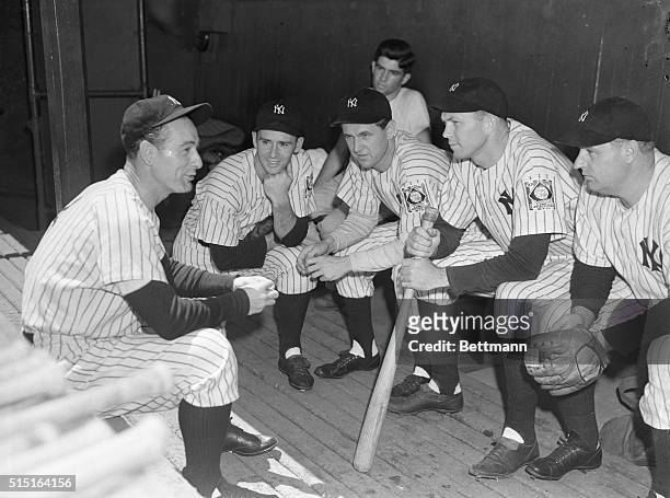 Lou Gehrig, Joe Gordon, Lefty Gomez and Bill Dickey , all of the New York Yankees, shown talking in the Yankee dugout, June 21, before the World...