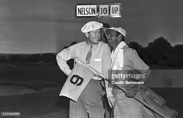 Byron Nelson, U.S. Open Golf Champion who comes from Reading, Pennsylvania, listening to congratulations of his caddy on the 9th green of the Pomonok...