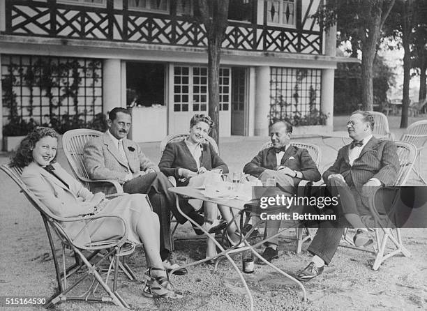 Left to right here are Mlle. Annie Vernay, french movie star; Archduke and Archduchess Francis Joseph of Austria; Baron Phillipe De Rothschild; and...