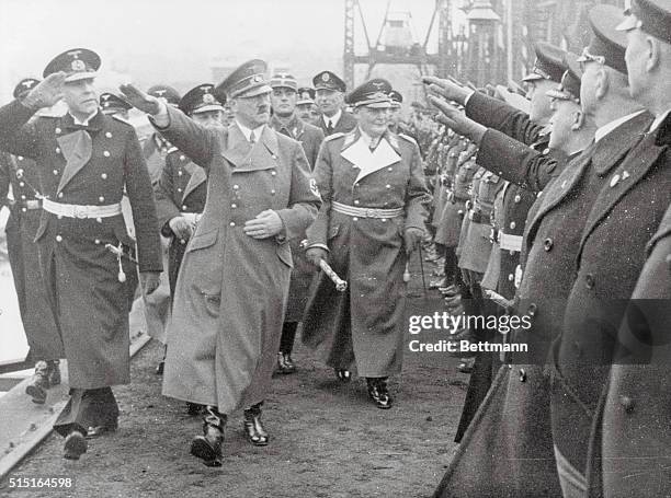 Hitler at Launching of First German Plane Carrier. Kiel, Germany: Adolf Hitler gives the Nazi salute as he reviewed Army and Navy officers during the...