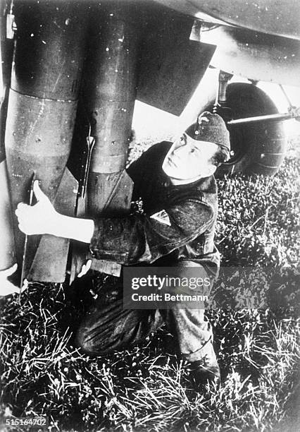 Loading Nazi "Eggs" of Destruction. Bombs being loaded on a German plane for an air raid on Poland, during the invasion of Poland by Nazi legions....