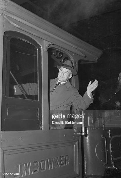 March 31, 1939 - New York: George T. Bye, president of the Wednesday culture society that met on Fridays, shown in the cab of the wood-burning...