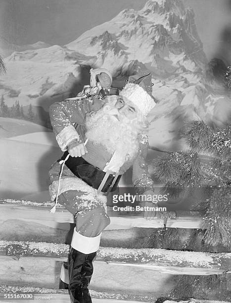Hollywood, CA- We'll bet you didn't recognize this Santa Claus as one of the ace horror men of the screen, Bela Lugosi. Bela says it is the nicest...