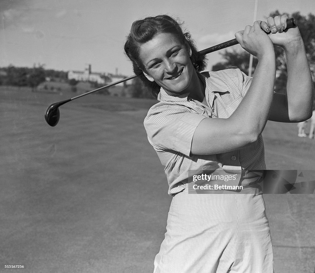 Babe Didrikson Smiling with Golf Club over her Shoulder