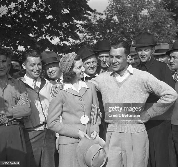 Ben Hogan, Texas sharpshooter, being congratulated by Mrs. Hogan after he won first prize of $1,000 in the Goodall Round Robin Golf Tournament over...