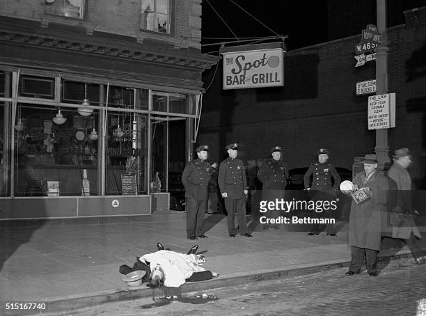 Murder victim David Beadle also known as David the Beetle in front of Spot Beer Tavern in Manhattan with policemen and crime photographer Weegee.
