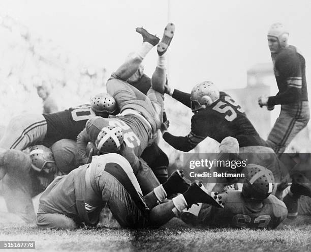 Line Drive in L.S.U.-Tennessee Game. Baton Rouge, Louisiana: Joe Wallen, University of Tennessee fullback, diving over the Louisiana State University...