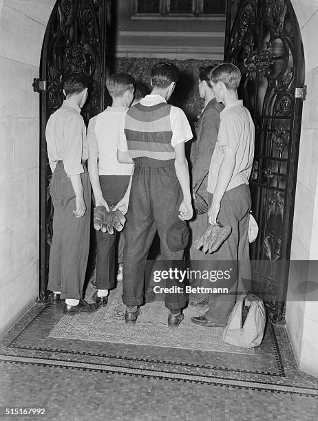 Baseball mitts and caps in hand, a group of boys form Commerce High School view the body of Lou Gehrig at the E. Willis Scott Funeral Parlor on 76th...