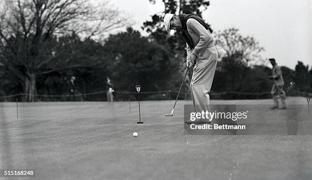 Golf's highest money winner, Ben Hogan, of Hershey, Pennsylvania, is shown putting during the opening round of the Masters' Golf Tournament. Hogan...