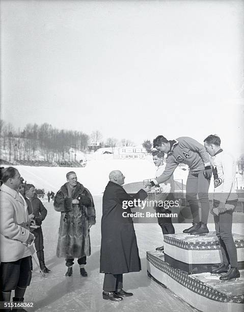 The 1932 Winter Olympic President awards Jack Shea here at Lake Placid, New York. Count De Baillet Latour, President of the International Olympic...