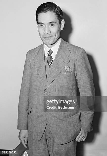 Lieutenant Commander Minoru Genda of the Japanese Embassy in London, is shown arriving at LaGuardia Field, via the Yankee Clipper. He was returning...