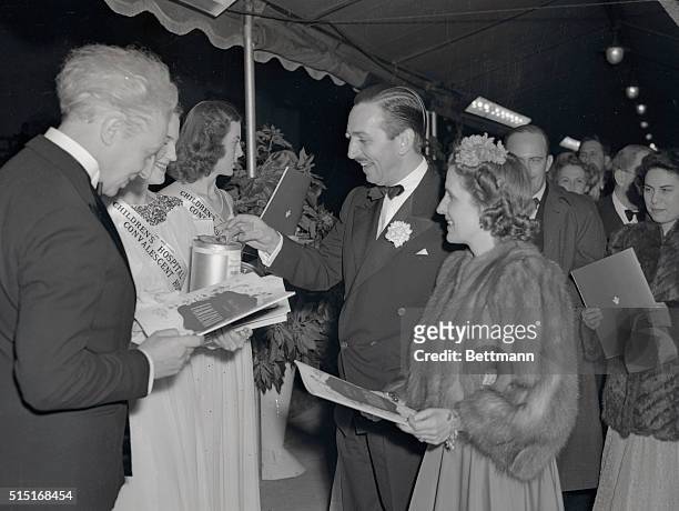Mr. And Mrs. Walt Disney and Leopold Stowkowski arriving at the Carthay Circle Theater, for the Hollywood premiere of Disney's Fantasia.