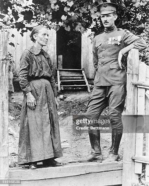 In front of his humble home in the hills of Tennessee, Sergeant Alvin Cullom York, posed with his mother, is shown after returning from the war. The...