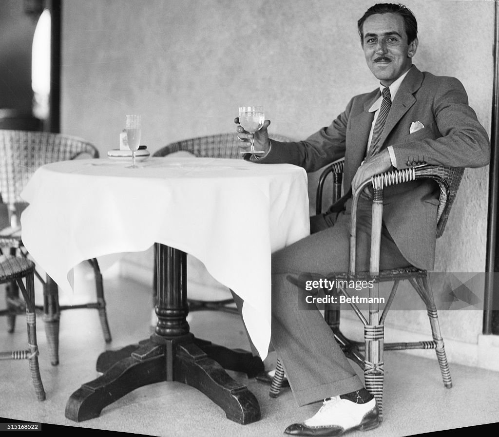 Walt Disney Sitting at Table