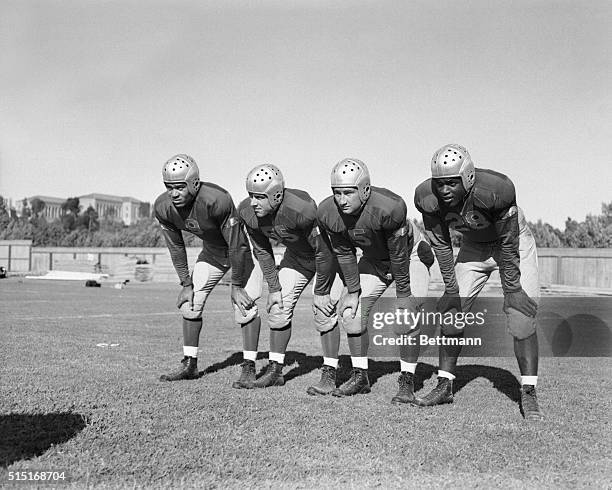 The 1st string backfield of the UCLA football team, left to right: Ray Bartlett, right halfback; Ned Matthews, quarterback; Bill Overlin, fullback;...