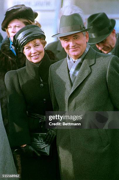 Reykjavik, Iceland- Soviet leader Mikhail Gorbachev joins his wife Raisa who is dressed in a stylish black outfit as they smile to the welcoming...