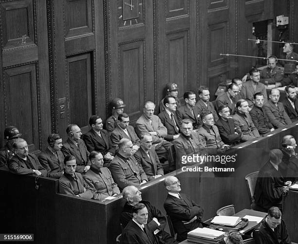 Twenty-three German doctors and scientists, one a woman, sit in the dock of Nuermberg court during their arraignment on charges of inhuman...