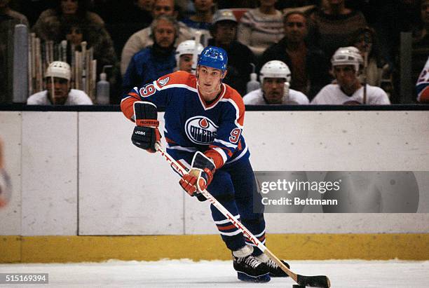 Wayne Gretzky, of the Edmonton Oilers, controls the puck during a game at Nassau Coliseum on Long Island in New York.