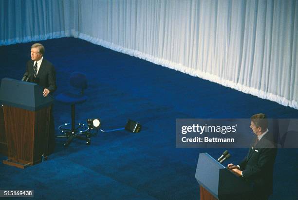 Cleveland, Ohio: President Jimmy Carter and his Republican challenger Ronald Reagan stand at their lectern answering questions during their debate in...