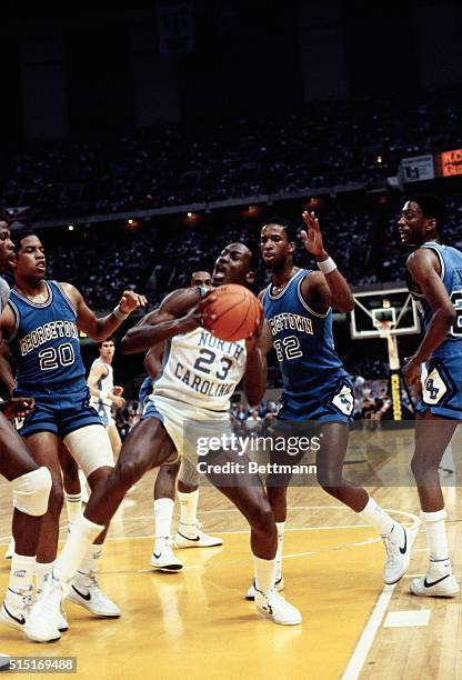 Action during the NCAA Championship as Fred Brown of Georgetown, defends against North Carolina's Michael Jordan.