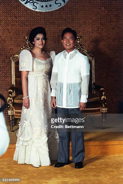 Philippine President Ferdinand Marcos poses with his wife Imelda in this full-length photo.