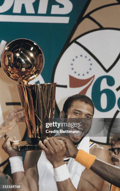 Inglewood, California: Los Angeles Lakers Kareem Abdul Jabaar holds up the NBA World Championship Trophy after the Lakers beat the Philadelphia 76ers...