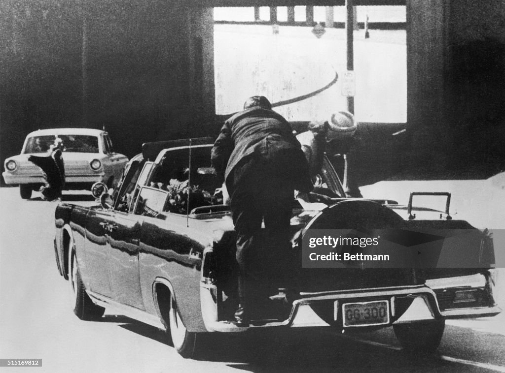 Secret Service Man Climbing onto President Kennedy's Car