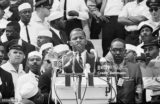 Washington, DC: Portrait of John Lewis, Chairman of the Student Non-Violent Coordinating Committee, speaking at the Lincoln Memorial to participants...