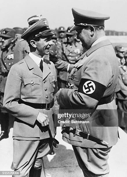 The two most prominent aides of Adolph Hitler, as they attended the recent Nazi convention at Nuremburg, pictured in pleased conversation. They are...