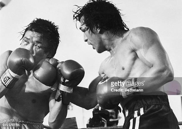 Las Vegas, NV- Ray Mancini, 134 3/4, lands a vicious right hand to the head of Duk-Koo Kim in the 14th round of their scheduled 15-round World Boxing...