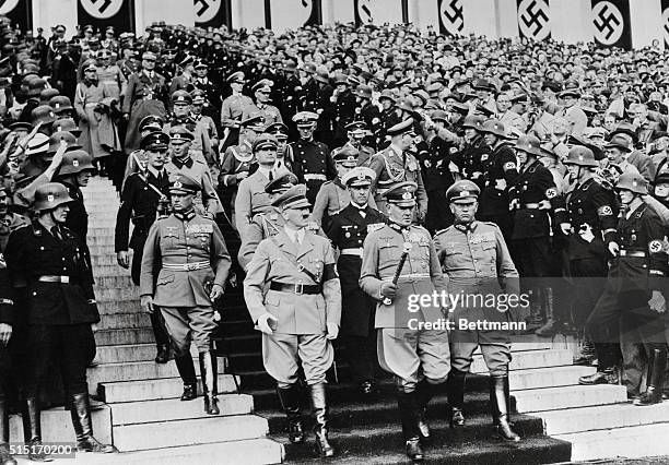 The group of high Nazi officials as they arrived at the Zeppelin Field for the review of 100,000 men from Germany's armed forces, at the conclusion...