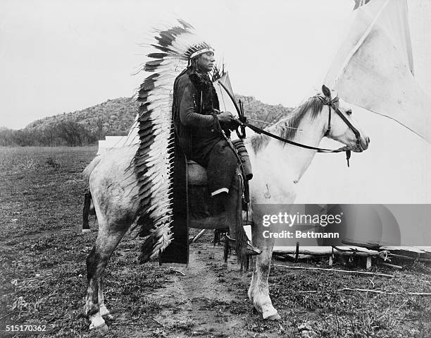 Cheif Quanah Parker in Comanche war costume on horse. Undated photo.