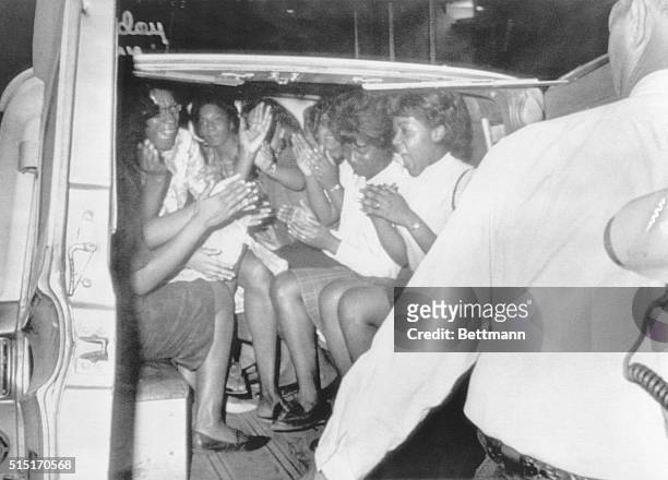 Nashville, TN: Part of some 36 demonstrators are loaded into a police paddy wagon after they refused to leave the front of a segregated restuarant....
