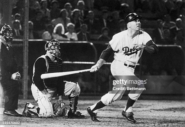 Los Angeles, CA- Duke Snider smashes a three-run homer to right field in the bottom of the ninth inning to give the Dodgers a 7-6 victory over the...