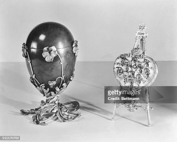 New York: Russian Imperial Gems Shown In New York. Spinach jade Easter egg, decorated with pansies of enamel and diamonds, mounted on a pedestal of...