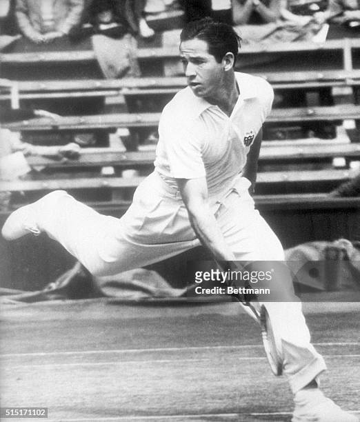 London, England- Bobby Riggs of Chicago in action on the center court of Wimbledon, London, as he beats his doubles teammate and room mate Elwood...